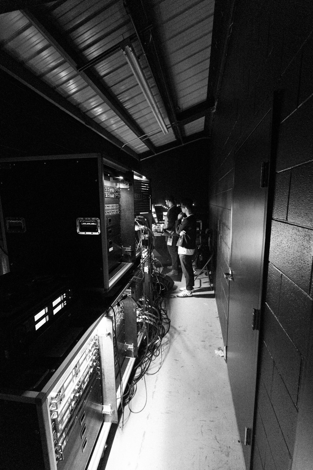 Production crew reviewing footage on monitors backstage