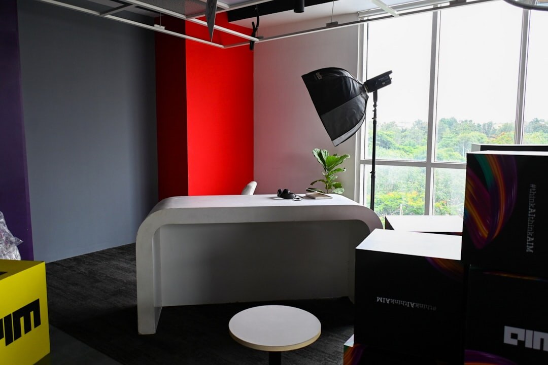Television news anchor desk set with studio lighting